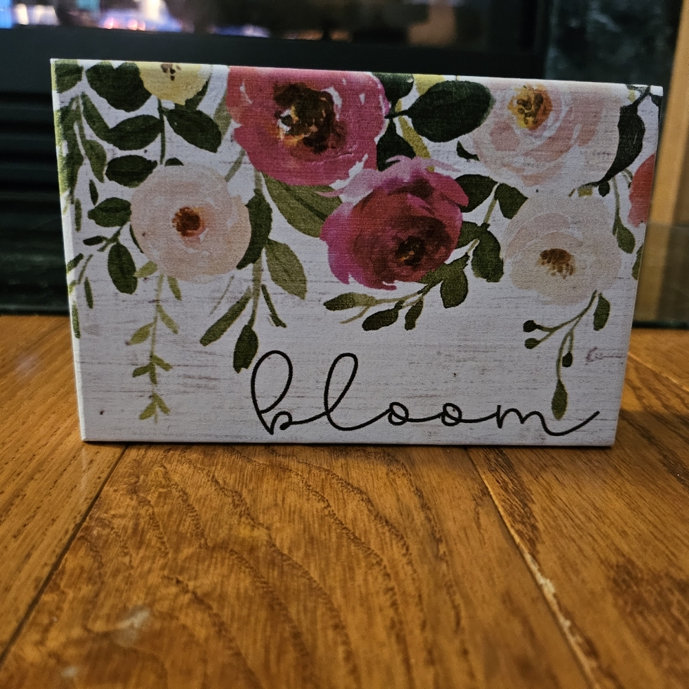 small "bloom" sign